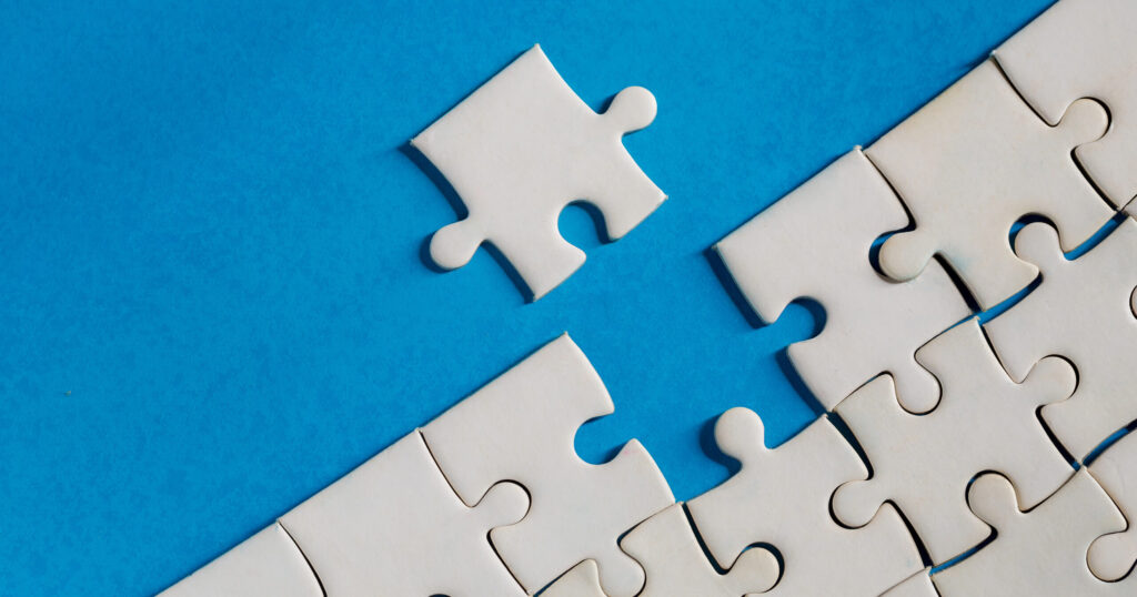 A puzzle piece adding to the rest of the pieces signifying integration of systems.